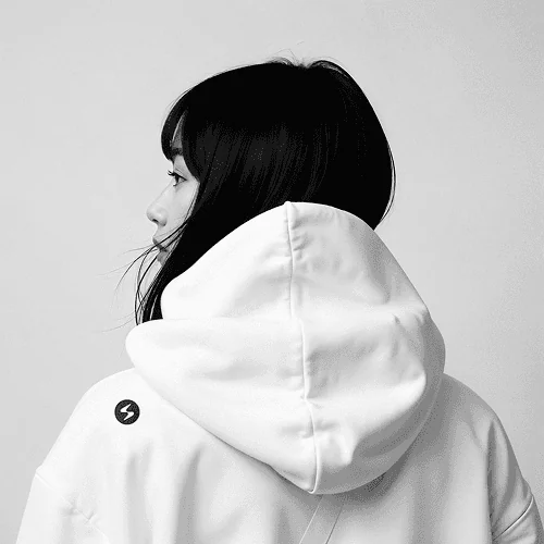 Branded hoodie worn by engineer, signaling team identity and brand lifestyle system