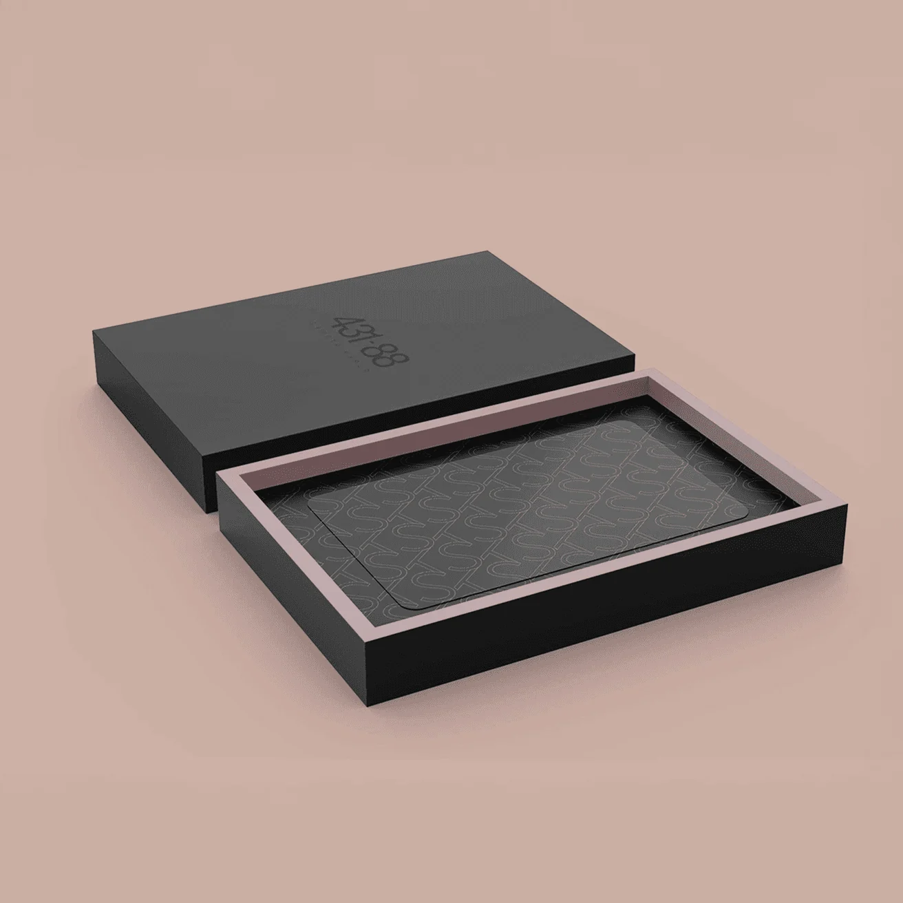 Matte black packaging with blind-emboss branding and modular inner tray