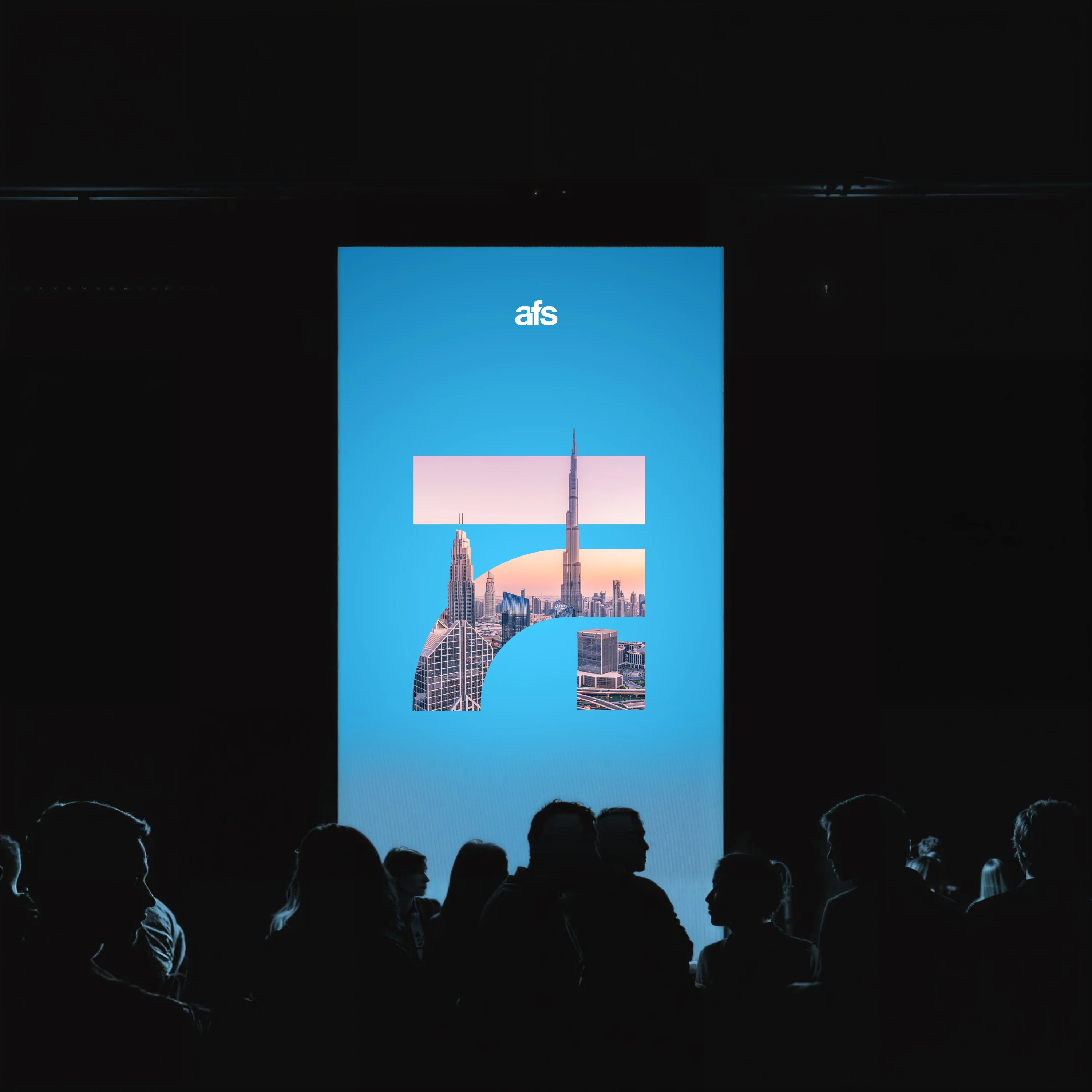 AFS launch event screen showing new symbol with city montage