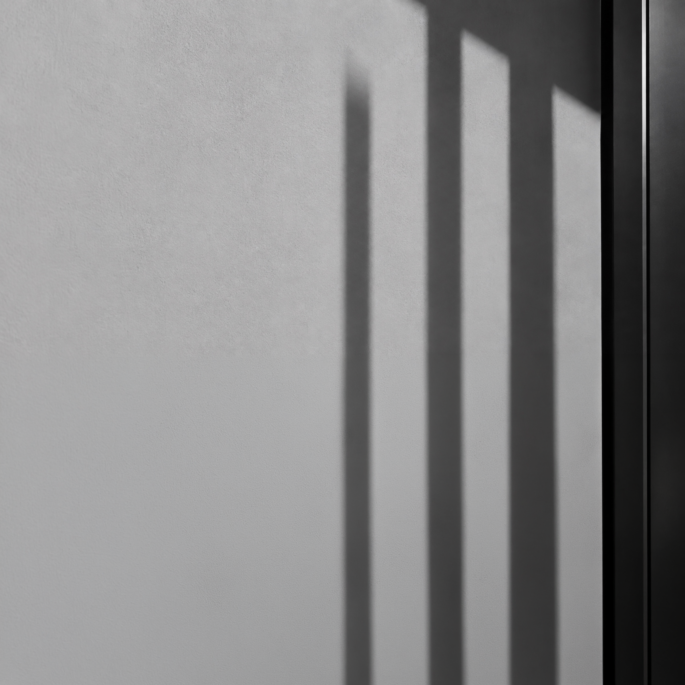 3one4 Capital monochrome wall and architectural shadows