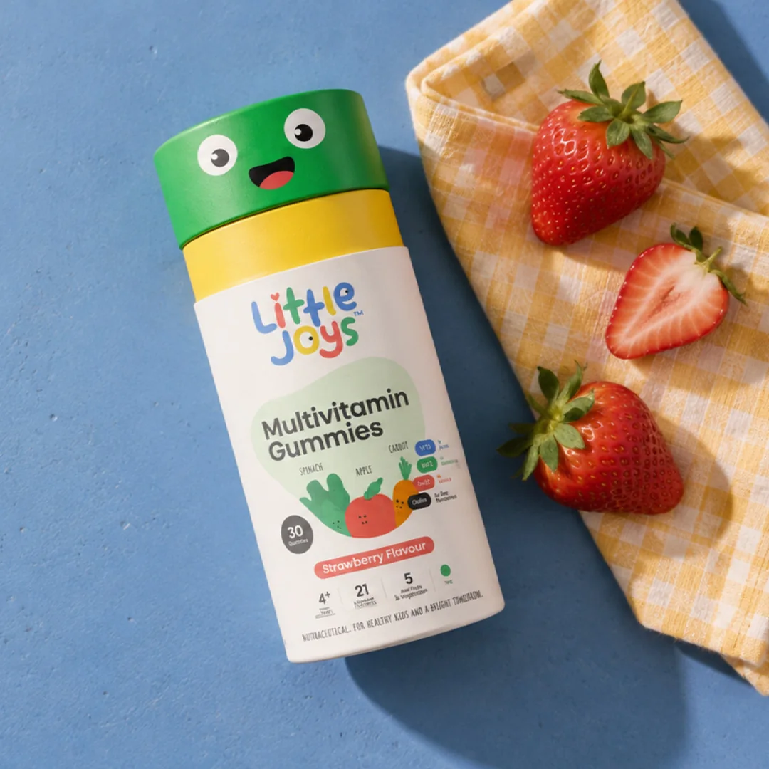 Little Joys gummy packaging on a blue tabletop